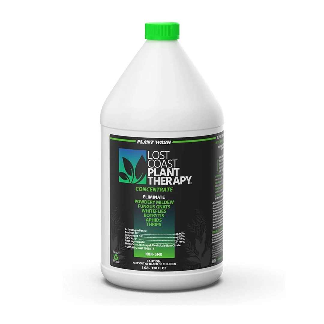 A white plastic bottle with a green cap labeled 'Lost Coast Plant Therapy', which is a pesticide product for plants.
