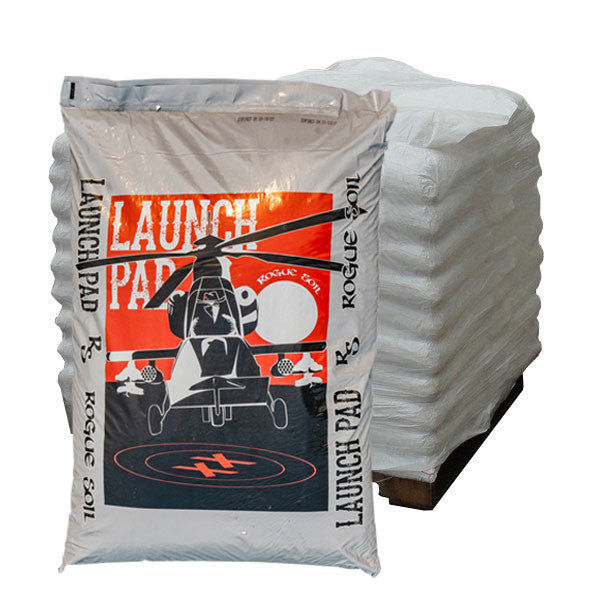 A bag of 'LAUNCH PAD' soil mix from Rogue Soil, featuring a graphic of an airborne helicopter with the text 'OUTLAW STYLE'.